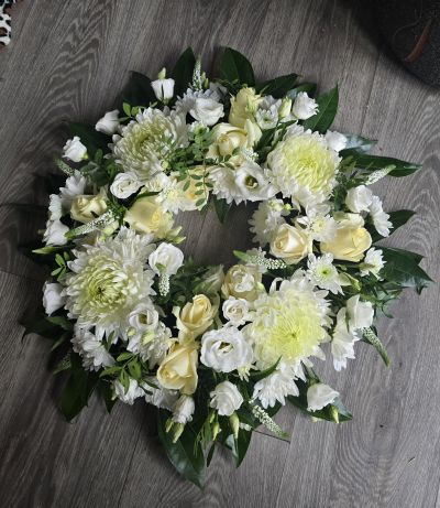 Wreath tribute - Lovely wreath tribute in whites with foilage, flowers may vary.